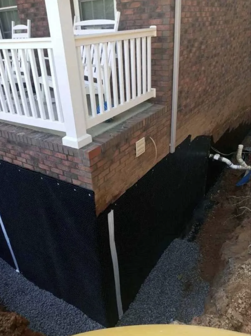 Exterior foundation waterproofing membrane and drainage trench